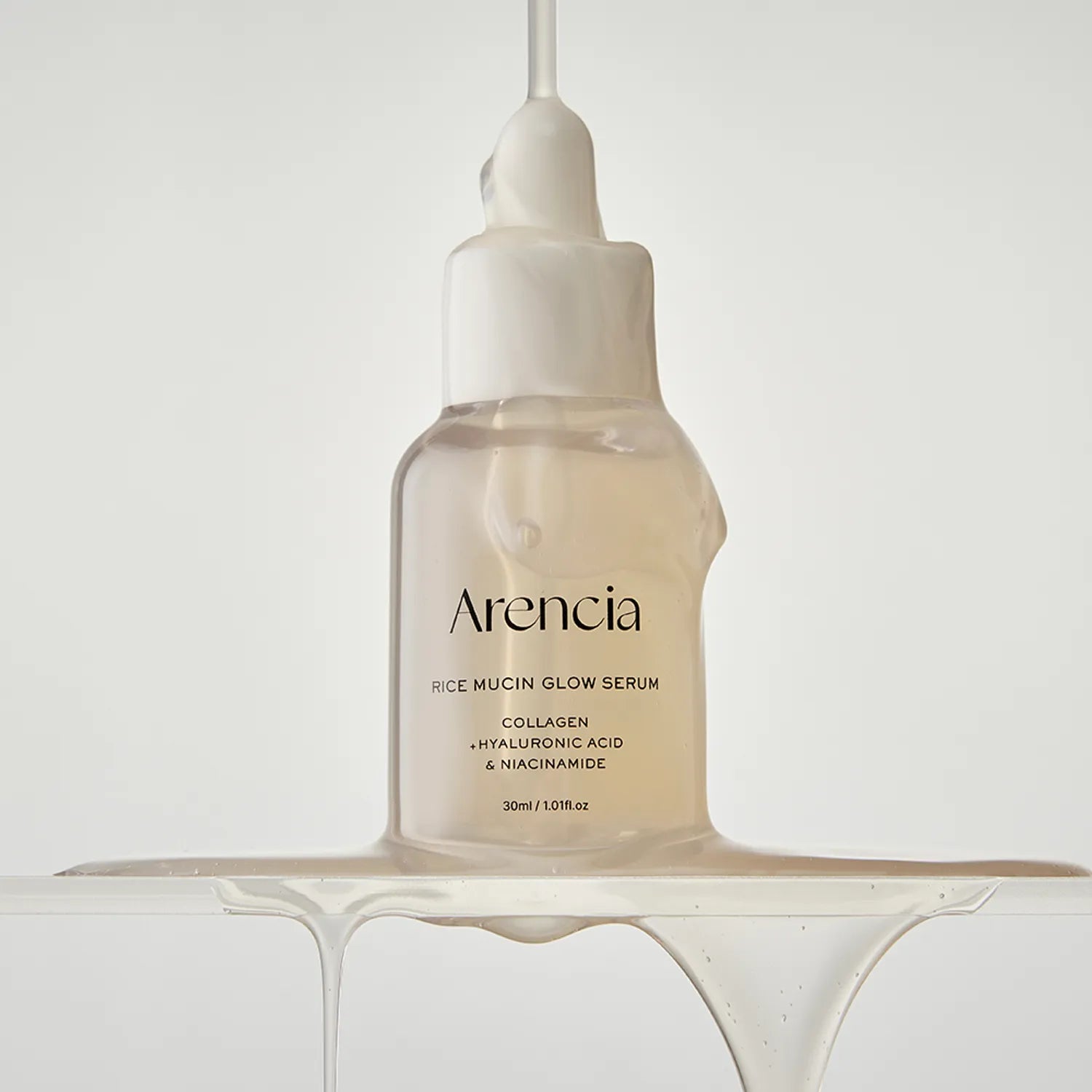 Arenicia rice mucin glow serum bottle on a white background