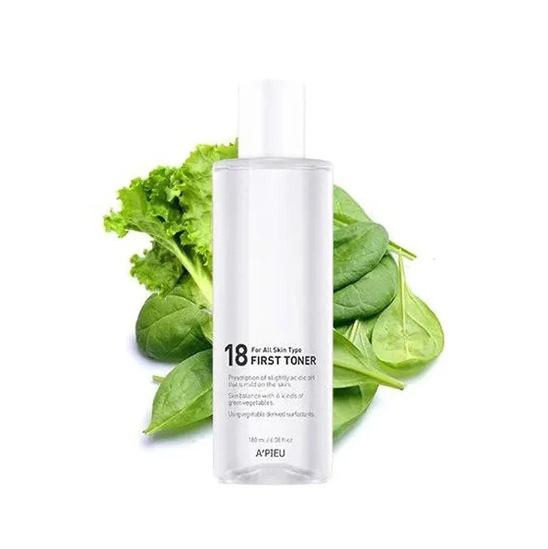 Skincare bottle labeled '18 First Toner' with green leaves on a white background