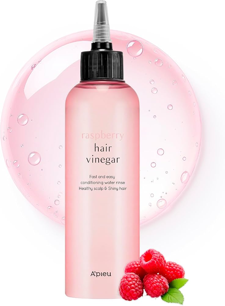 Pink bottle of hair vinegar with raspberry illustration on a white background
