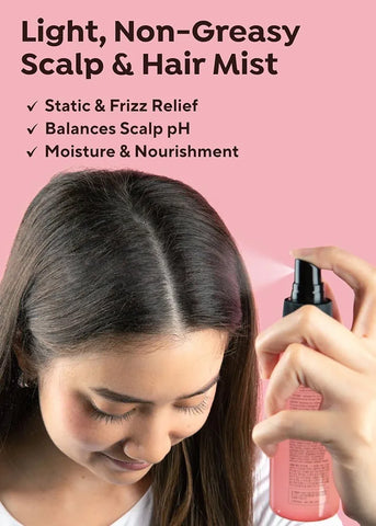 Person using a scalp and hair mist on a pink background with product features listed.