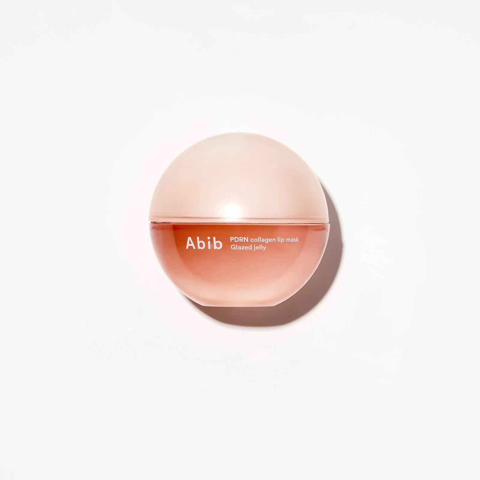 Pink lip balm abib pdrn collagen lip mask on the white background