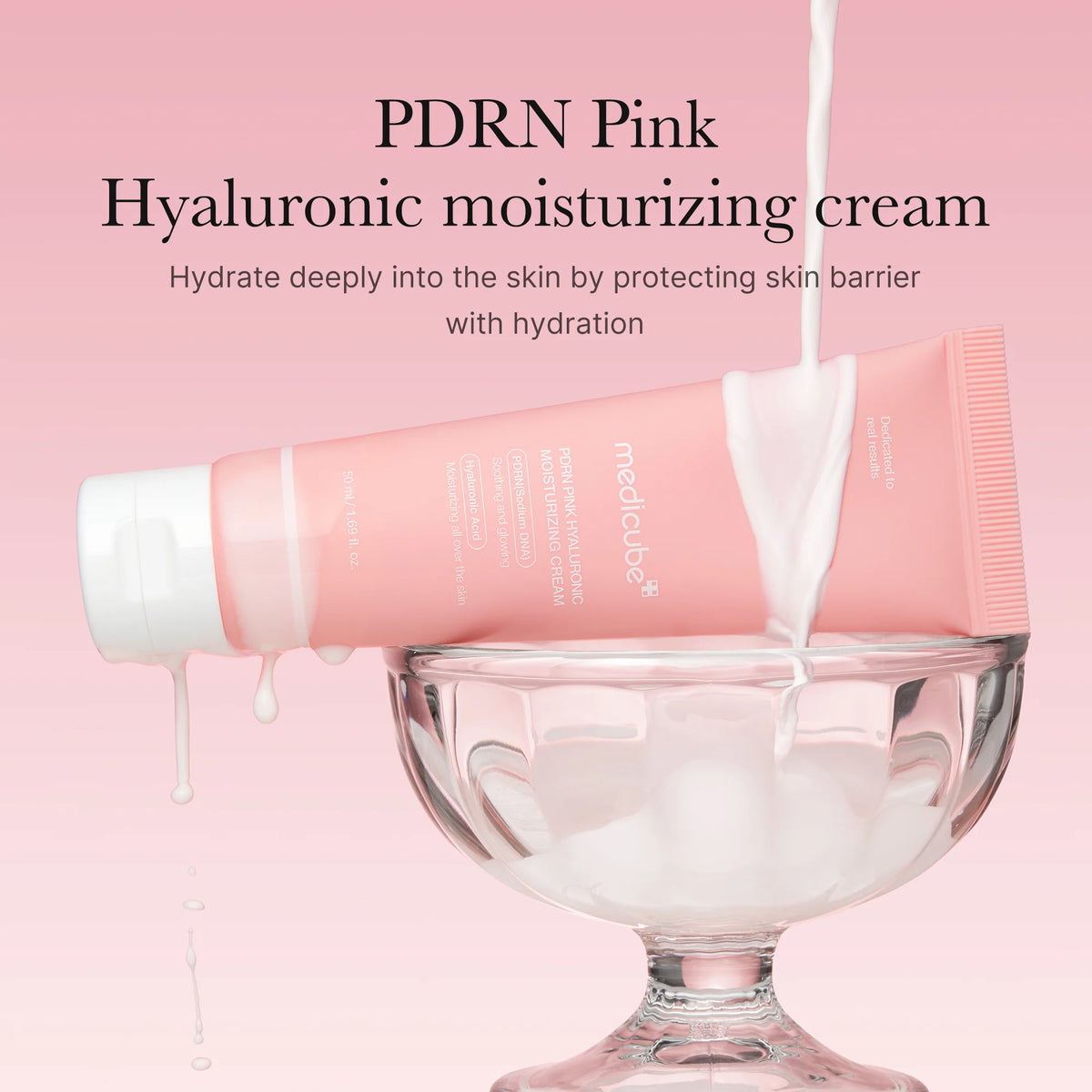 Pink hyaluronic moisturizing cream being poured into a glass container on a pink background